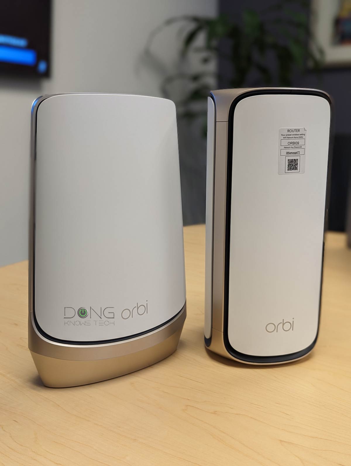 Orbi RBRE960 router vs. Orbi RBR970 router Front 1